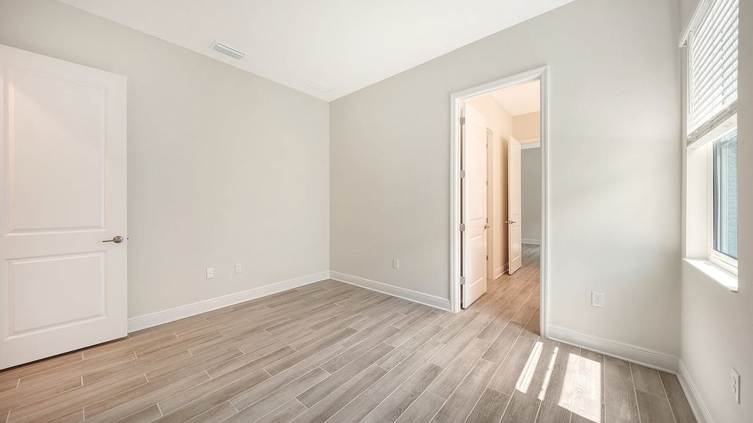 Spacious, unfurnished interior of a new home in Canoe Creek Real Estate and Homes for Sale in Parrish, FL - Neal Communities, Parrish (Image 56).