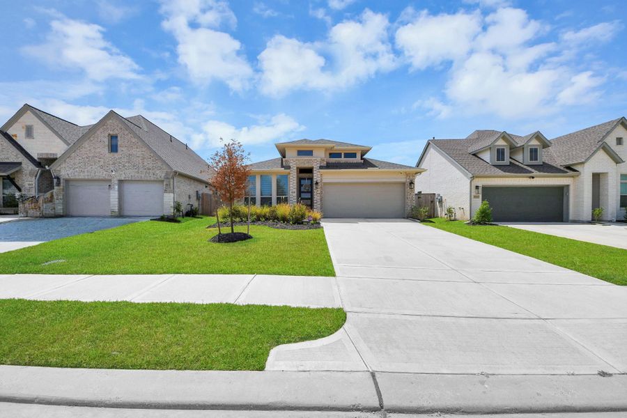 Front exterior of a new home in Escondido, Magnolia, TX, highlighting curb appeal (Image 2).