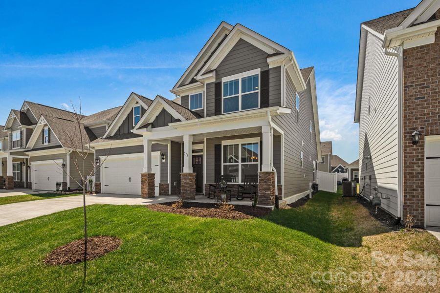 Front exterior of a new home in Cantrell Hills, Hendersonville, NC, highlighting curb appeal (Image 2). Front exterior of a new home in Cantrell Hills, Hendersonville, NC, highlighting curb appeal (Image 2).