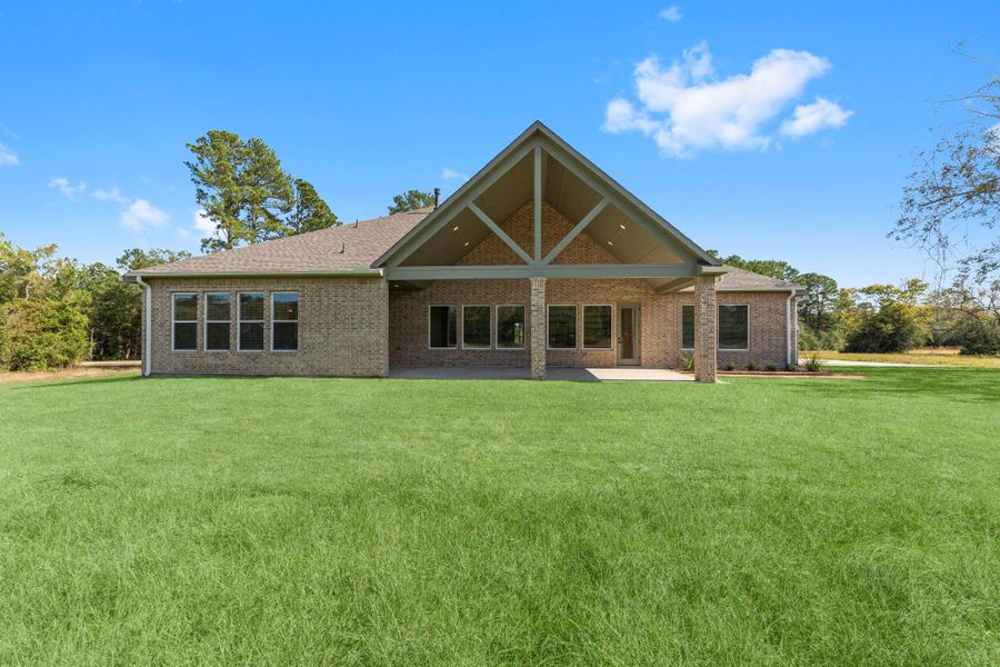 Exterior details and patio area of a home in Homestead Hill, New Waverly (Image 18).