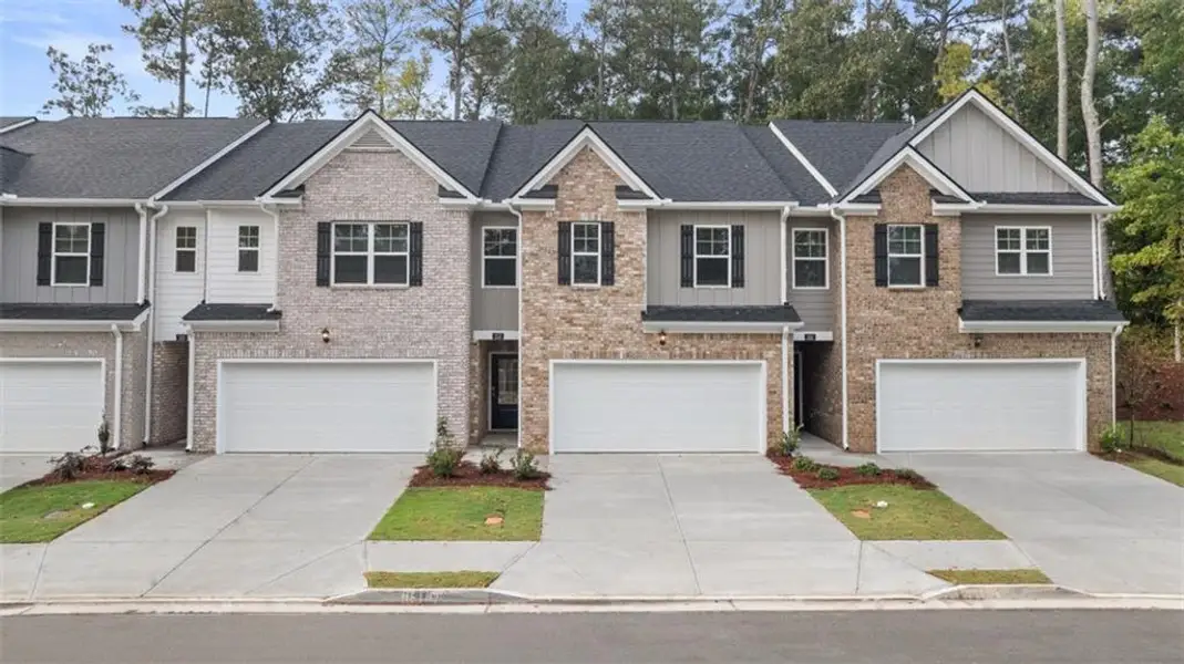 Front exterior of a new home in , Loganville, GA, highlighting curb appeal (Image 1). Front exterior of a new home in , Loganville, GA, highlighting curb appeal (Image 1).