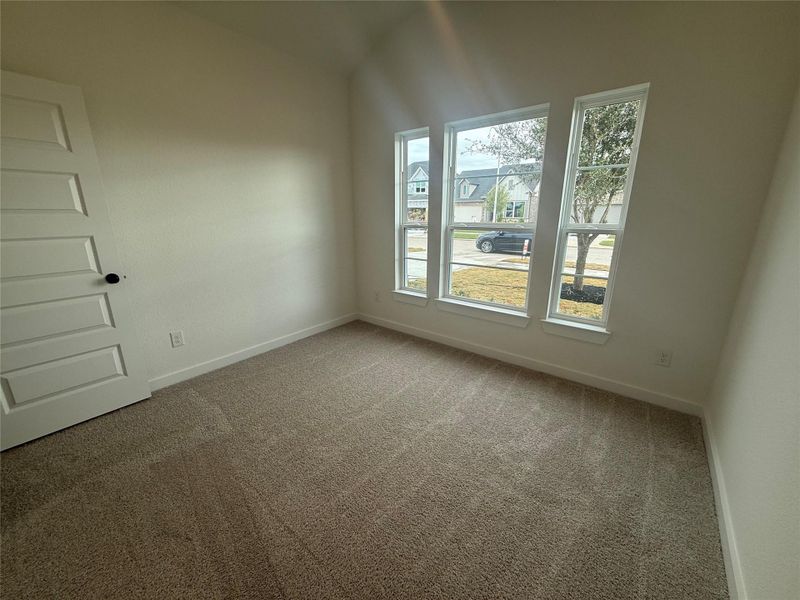 Spacious secondary bedroom downstairs with large closet. Spacious secondary bedroom downstairs with large closet.