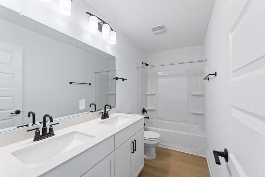 Photo of Pulte model home with same floor plan, not of actual home listed.