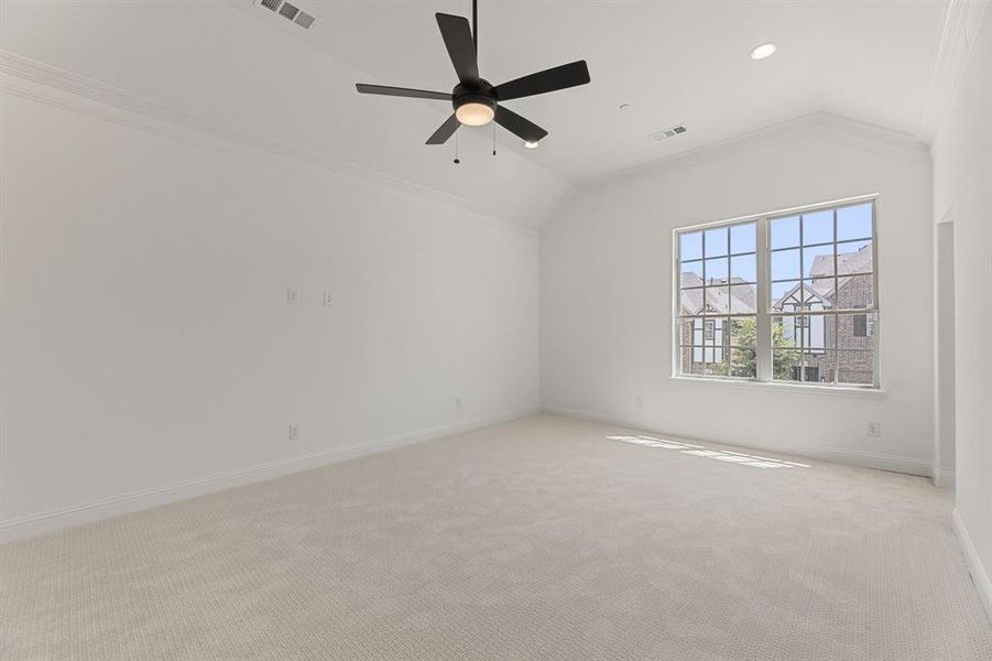 Unfurnished room with crown molding, vaulted ceiling, carpet, ceiling fan, and recessed lighting Unfurnished room with crown molding, vaulted ceiling, carpet, ceiling fan, and recessed lighting