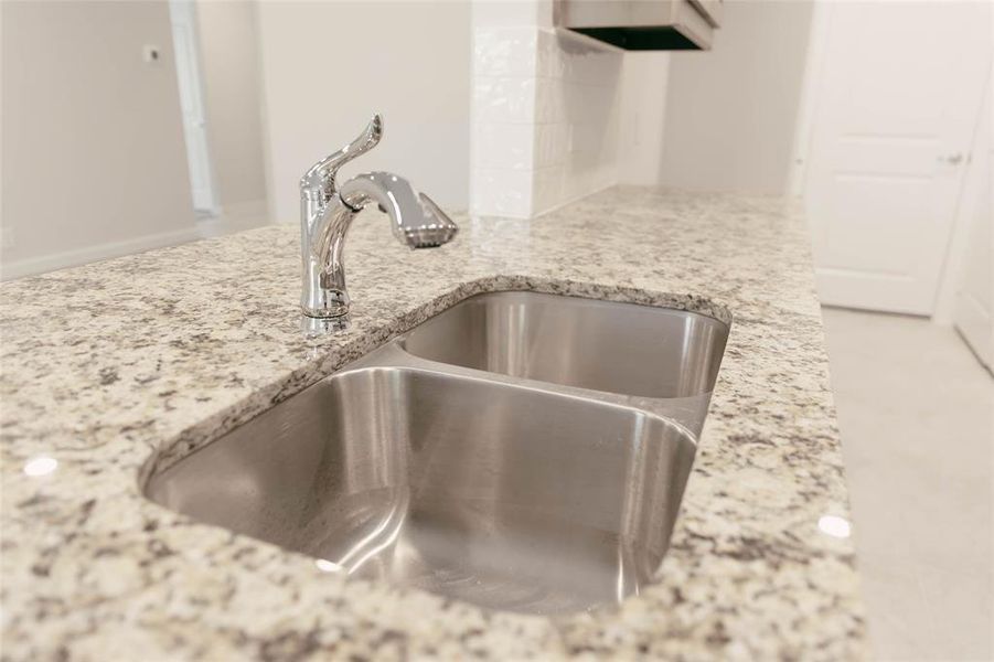 Details with light stone counters and sink