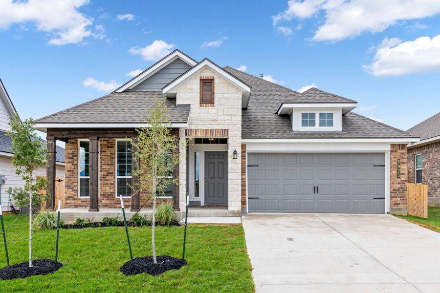 Front exterior of a new home in Gourd Creek, Bryan, TX, highlighting curb appeal (Image 1). Front exterior of a new home in Gourd Creek, Bryan, TX, highlighting curb appeal (Image 1).