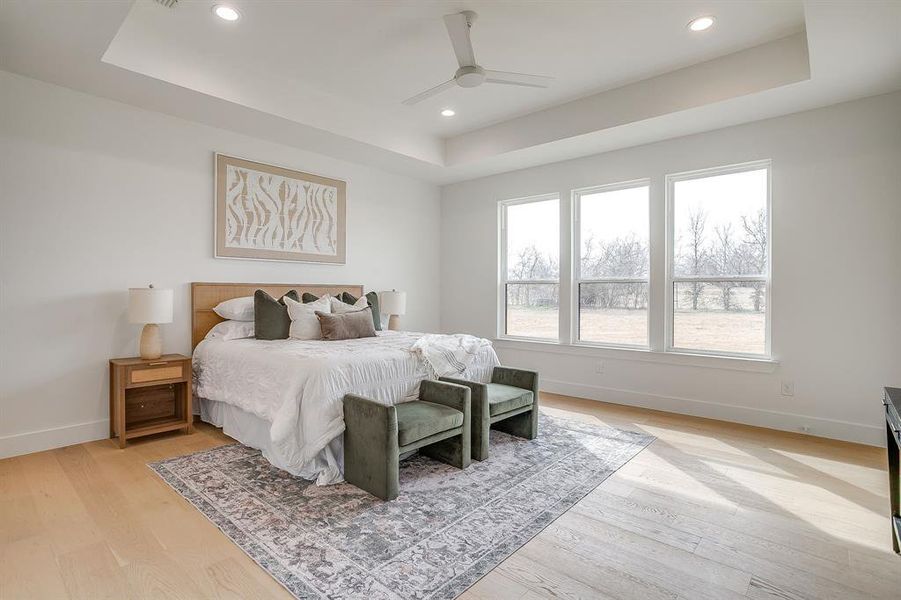 primary bedroom with large windows primary bedroom with large windows