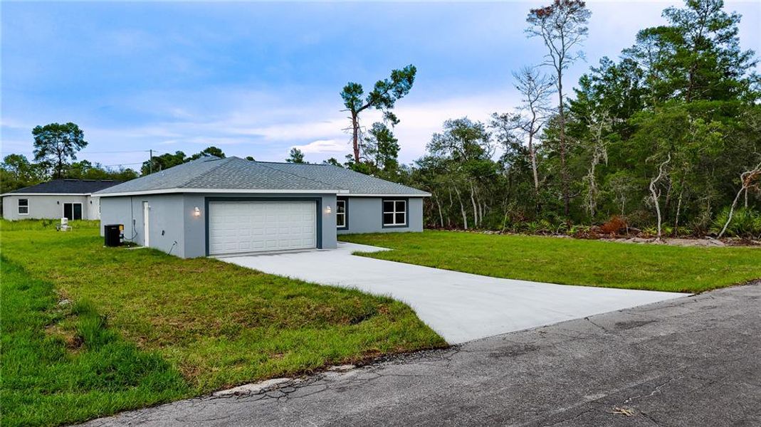 Front exterior of a new home in , Ocklawaha, FL, highlighting curb appeal (Image 2). Front exterior of a new home in , Ocklawaha, FL, highlighting curb appeal (Image 2).