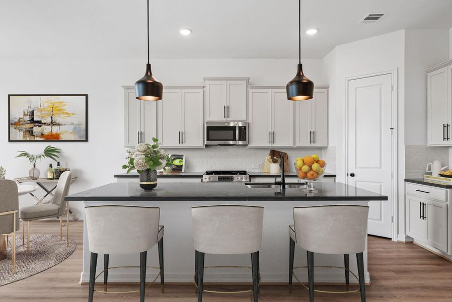 Well-designed kitchen featuring generous counter space, plenty of storage, and a walk-in pantry for organization.