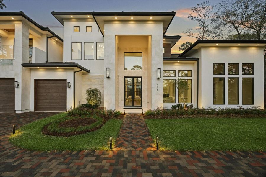 A striking modern estate showcasing clean architectural lines, dramatic walls of glass, and exceptional craftmanship, offering luxury living at its finest. A striking modern estate showcasing clean architectural lines, dramatic walls of glass, and exceptional craftmanship, offering luxury living at its finest.