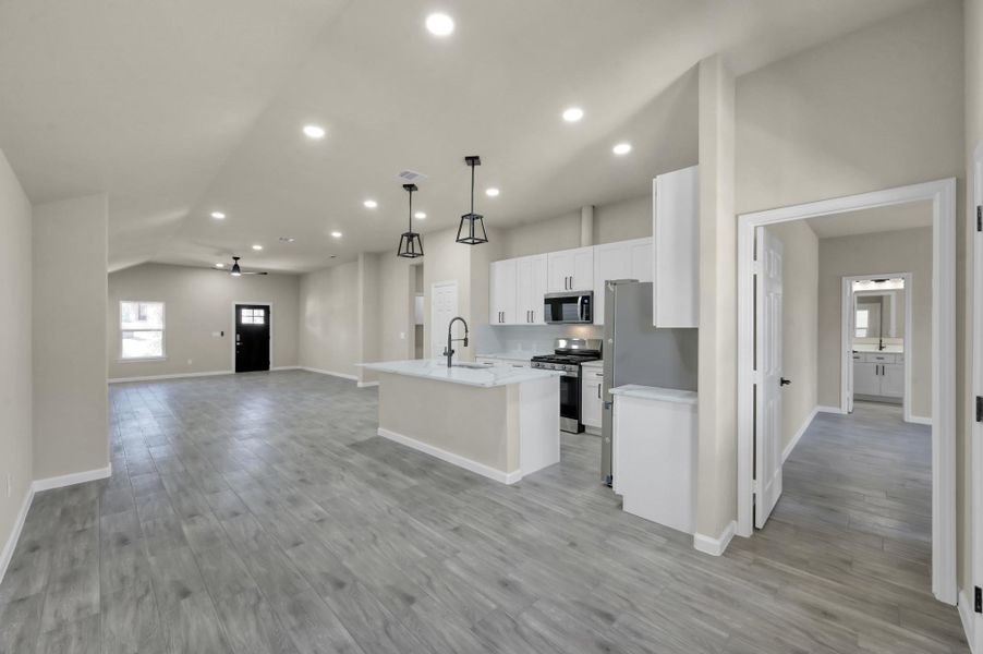 Perspective view showing the transition from the main living area to the private hallway, emphasizing the home's thoughtful and navigable floor plan.