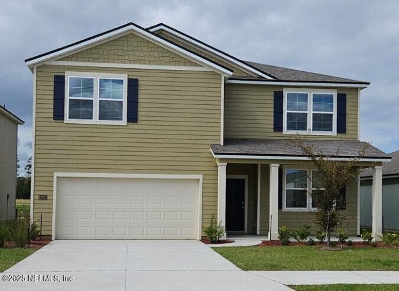Front exterior of a new home in The Arbors, Jacksonville, FL, highlighting curb appeal (Image 21).