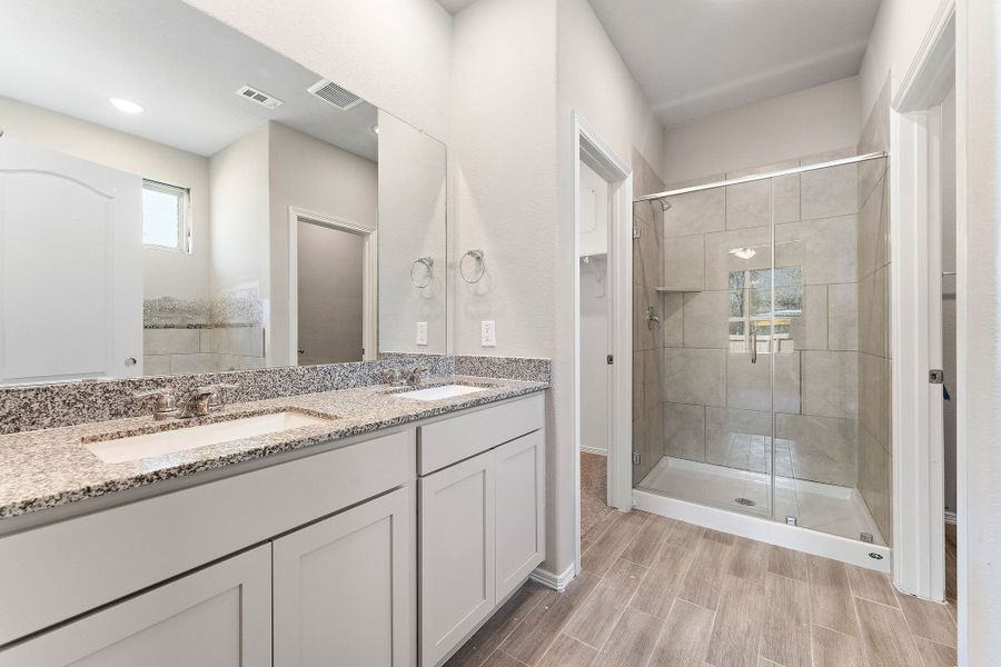 A bathroom with a marble countertop. A bathroom with a marble countertop.