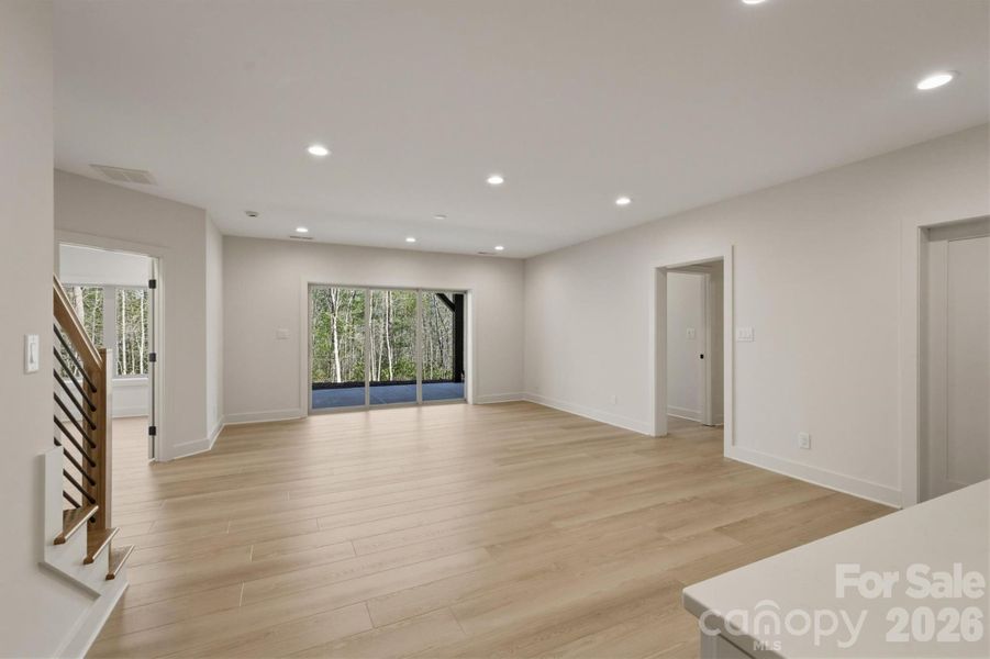 On the other side of this room are doors leading to the outdoor, lower level patio that is covered from the upstairs porch roof. On the other side of this room are doors leading to the outdoor, lower level patio that is covered from the upstairs porch roof.