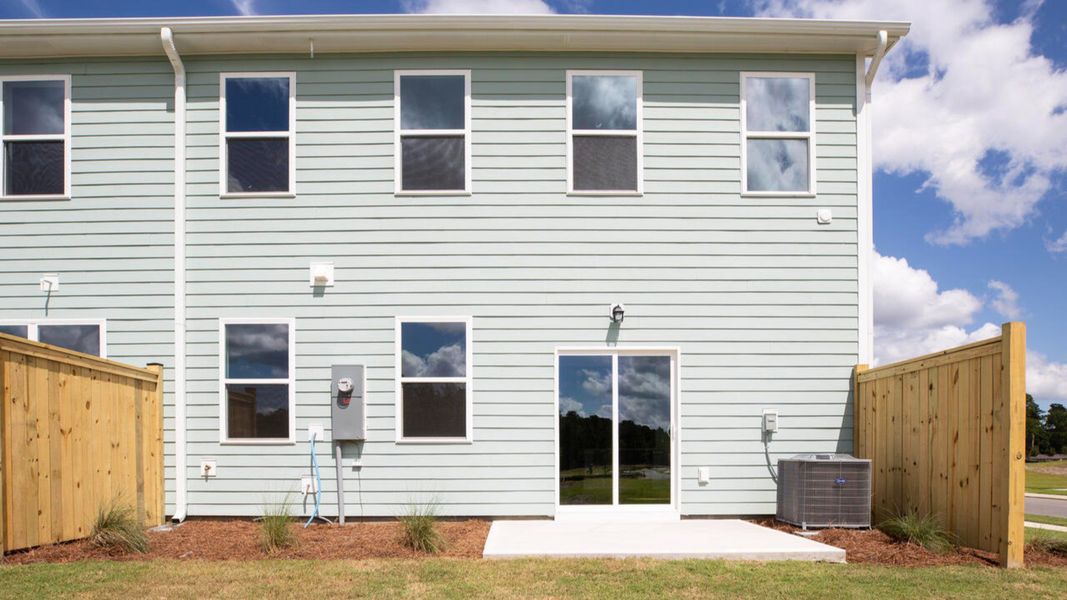 Exterior details and patio area of a home in Indigo Preserve Townhomes, Leland (Image 2).