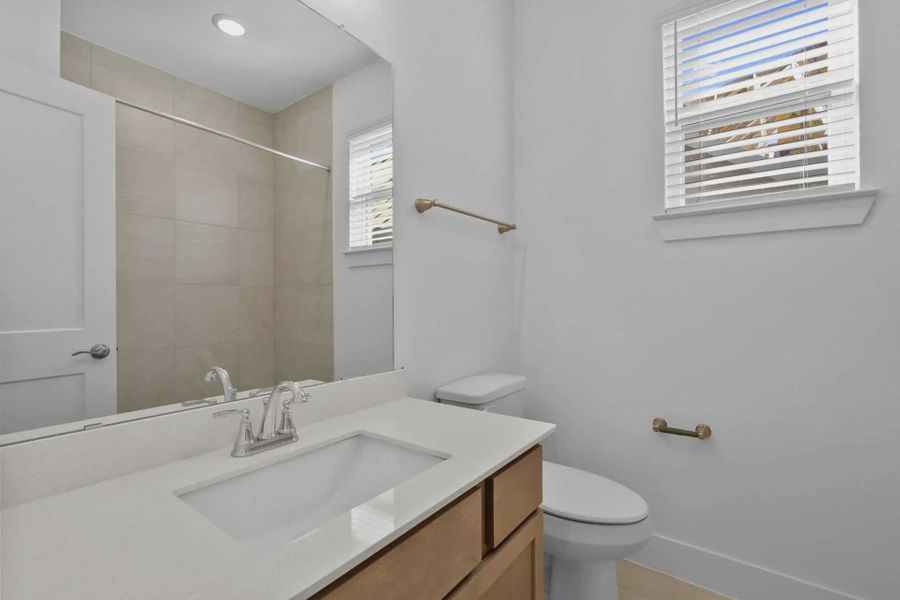 Representative furnished interior of a home built from the Chalet by Chesmar Homes in Meridiana Townhomes, Iowa Colony (Image 9).