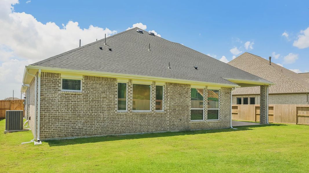 Exterior details and patio area of a home in Riceland 60',65',70', Mont Belvieu (Image 28).