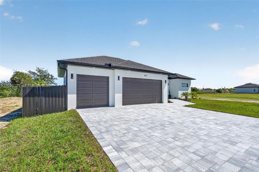 Front exterior of a new home in , Cape Coral, FL, highlighting curb appeal (Image 29).