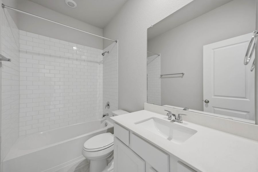 Furnished interior view inside a new home in Sunterra 40, Katy (Image 15).