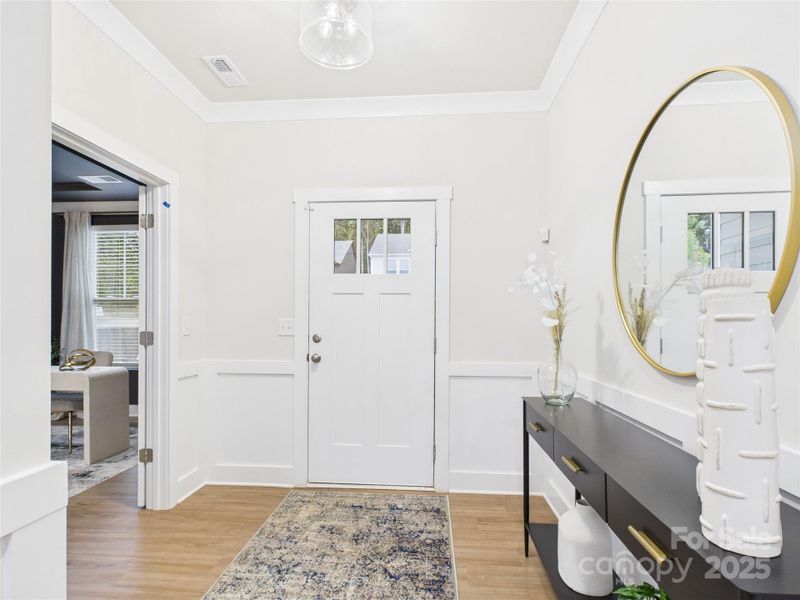 Foyer with crown molding and judge's panels Foyer with crown molding and judge's panels