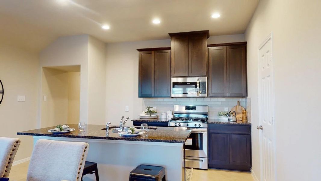 Furnished interior view inside a new home in Sunterra, Katy (Image 14).