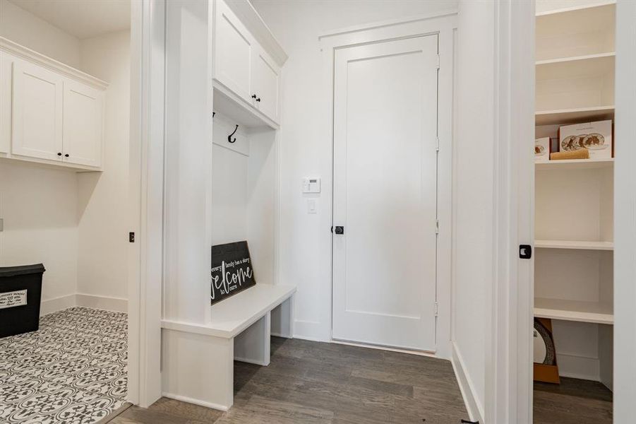 Mudroom featuring dark wood-type flooring