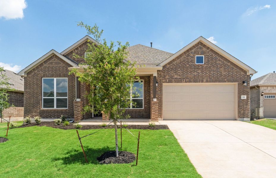Front exterior of a new home in 6 Creeks, Kyle, TX, highlighting curb appeal (Image 22).