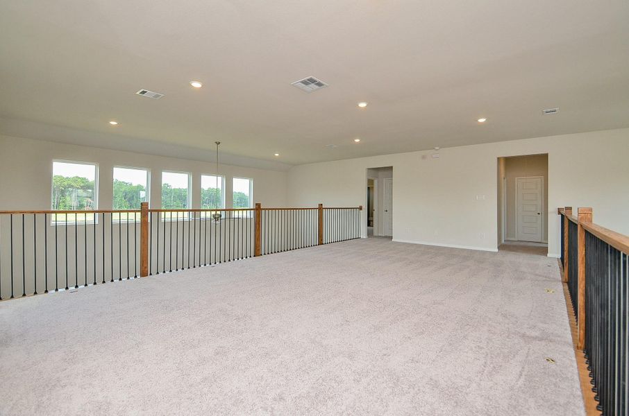 On the upper level there is an open game room/ living space. On the upper level there is an open game room/ living space.