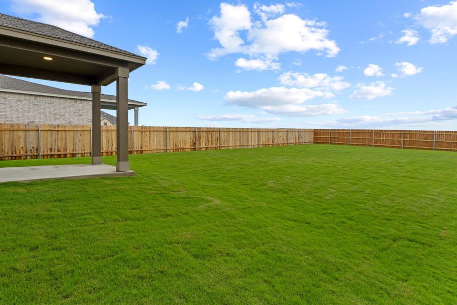 Front exterior of a new home in Salerno - Classic Collection, Round Rock, TX, highlighting curb appeal (Image 20). Front exterior of a new home in Salerno - Classic Collection, Round Rock, TX, highlighting curb appeal (Image 20).