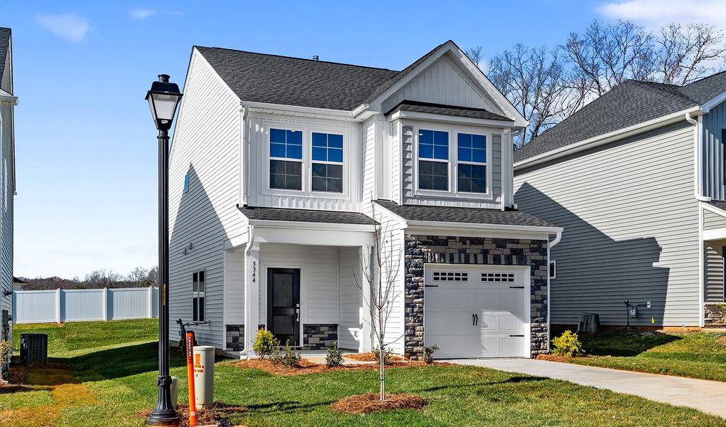 Front exterior of a new home in Hanes Lake, Winston-Salem, NC, highlighting curb appeal (Image 20).
