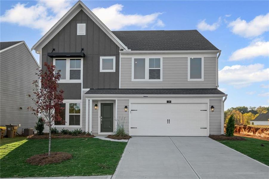 Front exterior of a new home in Twin Lakes, Hoschton, GA, highlighting curb appeal (Image 1). Front exterior of a new home in Twin Lakes, Hoschton, GA, highlighting curb appeal (Image 1).