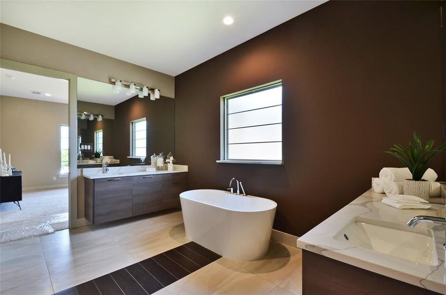 Bathroom with double vanity, a soaking tub, tile patterned flooring, and recessed lighting Bathroom with double vanity, a soaking tub, tile patterned flooring, and recessed lighting
