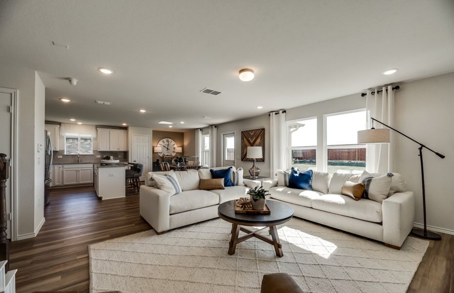 Spacious gathering room with views of kitchen