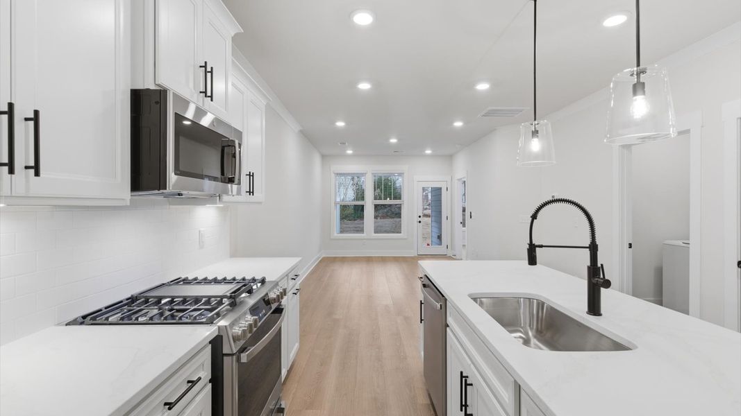 Vibrant kitchen layout with a center island, refined finishes, and open-concept flow located in Greenville, SC