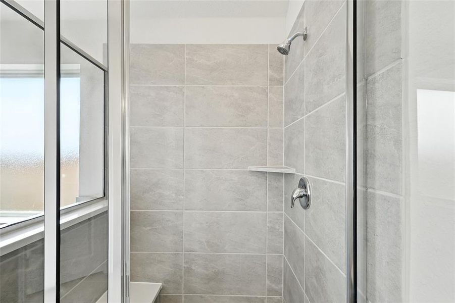 Bathroom featuring a shower stall Bathroom featuring a shower stall