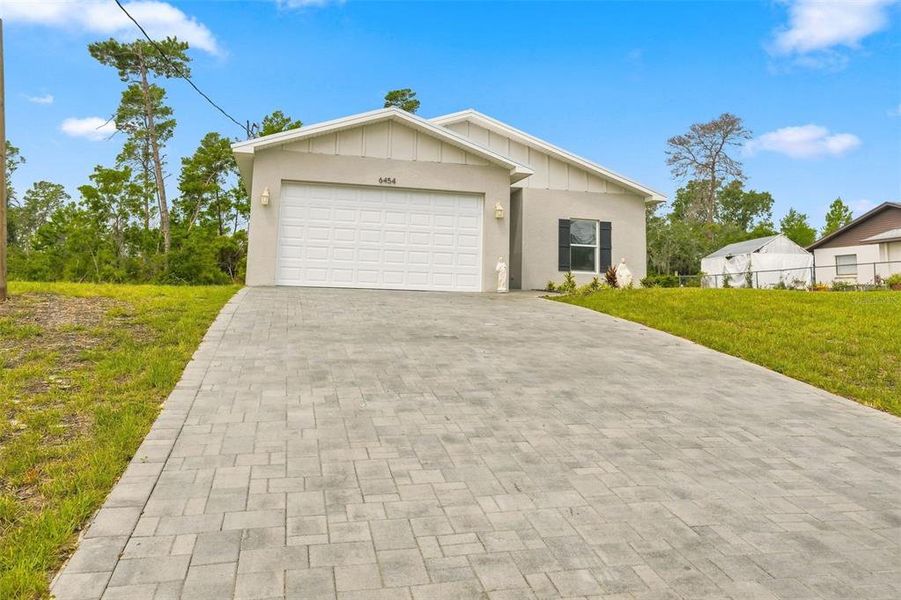 Front exterior of a new home in , Spring Hill, FL, highlighting curb appeal (Image 22).