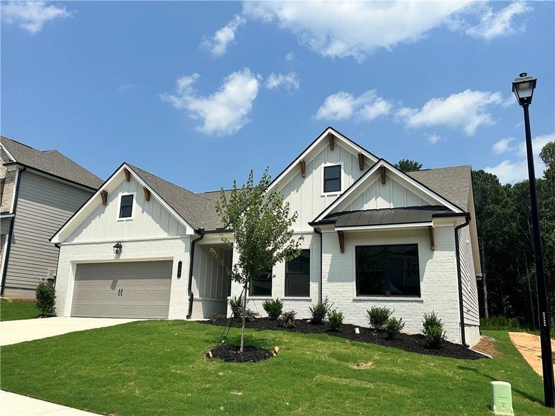 Front exterior of a new home in Summerlin, Winder, GA, highlighting curb appeal (Image 22).