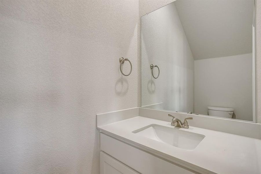 Bathroom with vanity and toilet