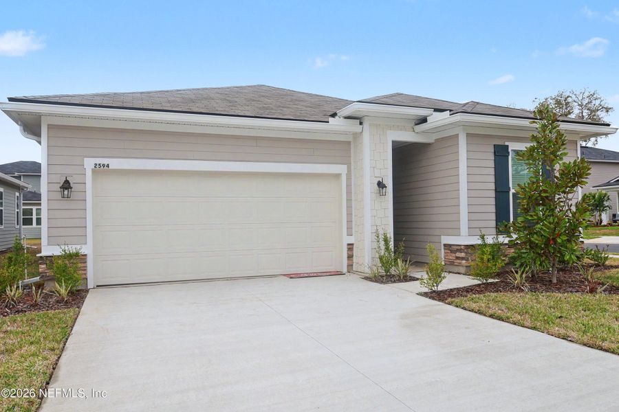 Front exterior of a new home in Irongate, Jacksonville, FL, highlighting curb appeal (Image 2). Front exterior of a new home in Irongate, Jacksonville, FL, highlighting curb appeal (Image 2).