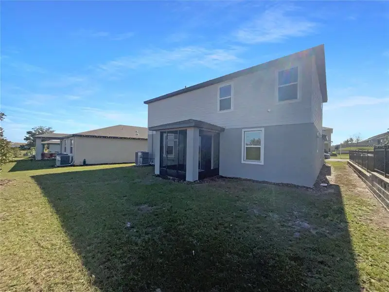 Exterior details and patio area of a home in Eden Hills, Lake Alfred (Image 3).