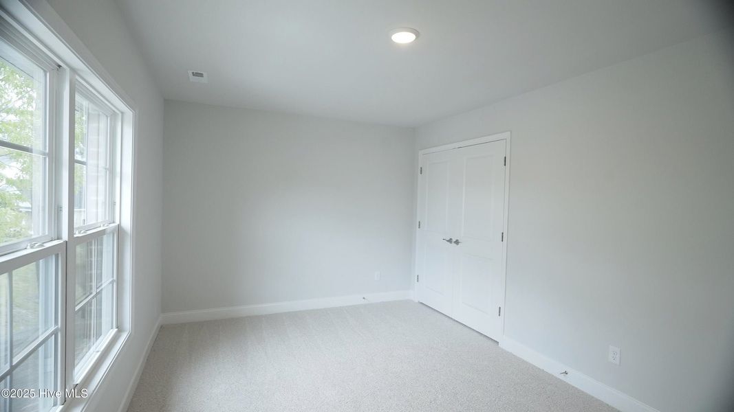 Spacious, unfurnished interior of a new home in Palmetto Creek, Bolivia (Image 26).