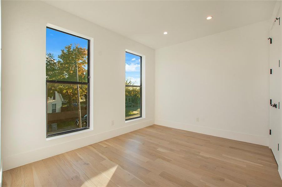 Unfurnished room featuring light wood-type flooring