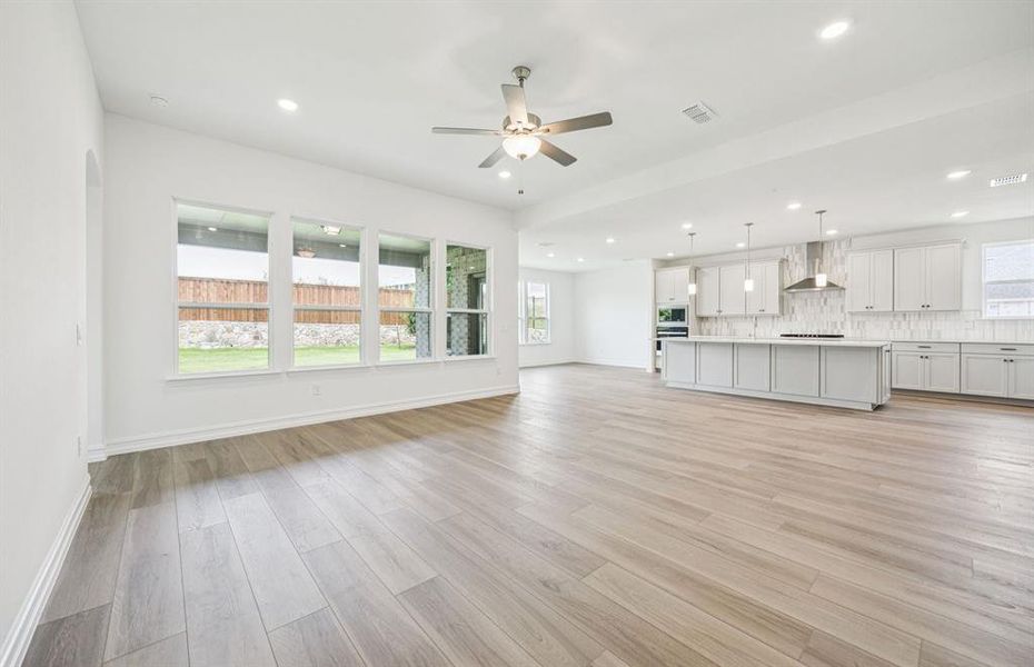 Open concept gathering room creating a spacious and inviting atmosphere *Real home pictured Open concept gathering room creating a spacious and inviting atmosphere *Real home pictured