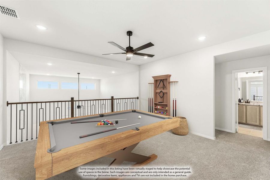 Upstairs game room with pool table, ceiling fan, iron railing, and adjacent bathroom visible through doorway