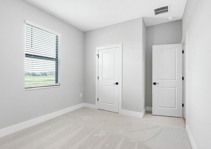 Each secondary bedroom includes carpet, a closet and bright open windows