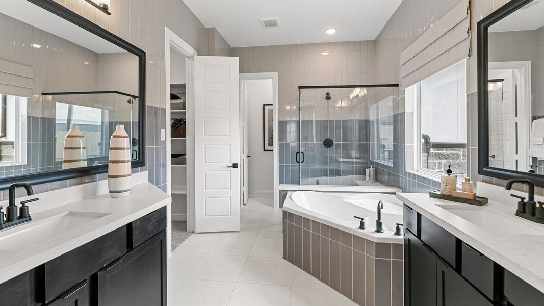 Representative furnished interior of a home built from the Magnolia by Brightland Homes in Sunterra, Katy (Image 14).