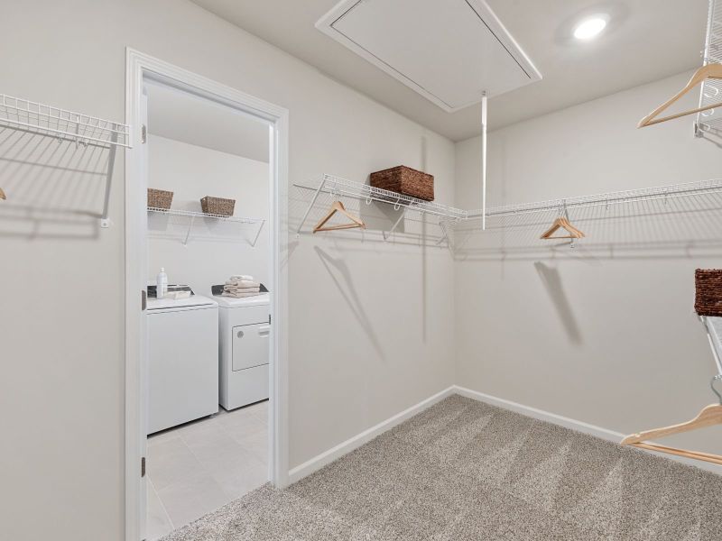 Laundry is a breeze with easy access from the primary suite.