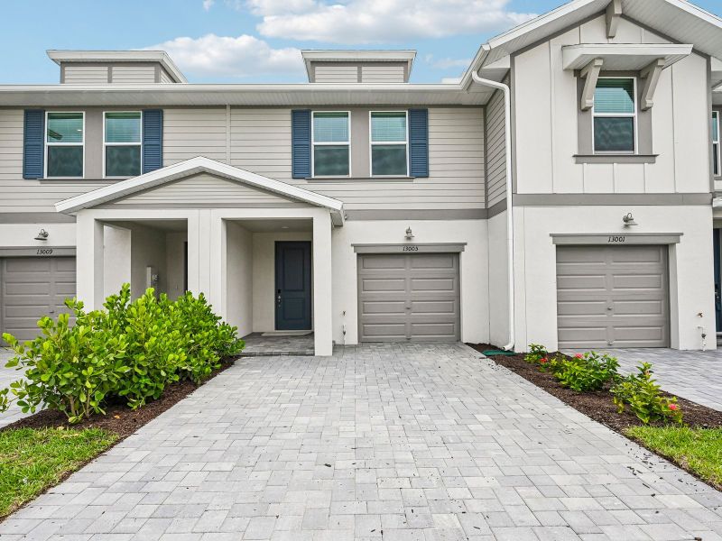 Front exterior of a new home in Meritage Homes at Central Park, Port St. Lucie, FL, highlighting curb appeal (Image 1). Front exterior of a new home in Meritage Homes at Central Park, Port St. Lucie, FL, highlighting curb appeal (Image 1).