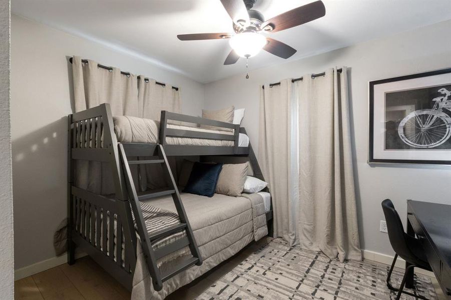 Bedroom featuring ceiling fan and baseboards Bedroom featuring ceiling fan and baseboards
