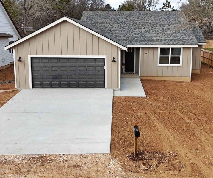 Aerial view of the home with driveway